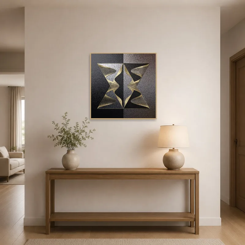Geometric art in gold and black enhancing an elegant entrance hall.