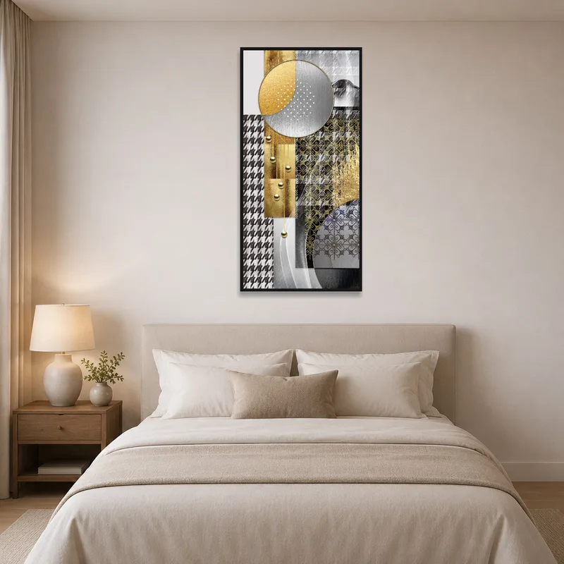 Geometric art piece above a bed with neutral linens.