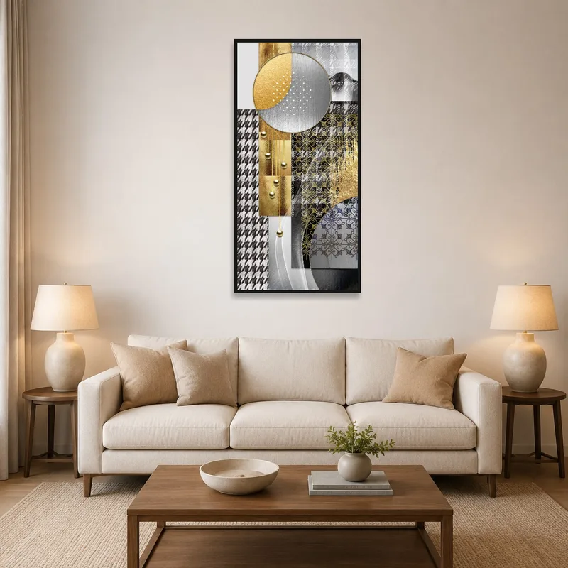Art with gold and silver geometric shapes above a modern sofa.
