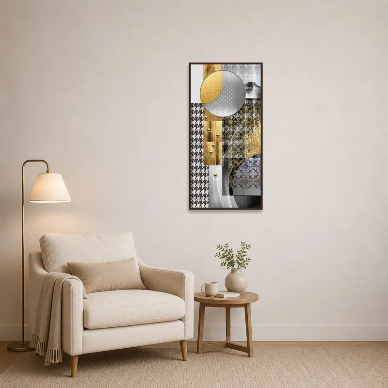 Gold and silver geometric art near a cozy reading chair.