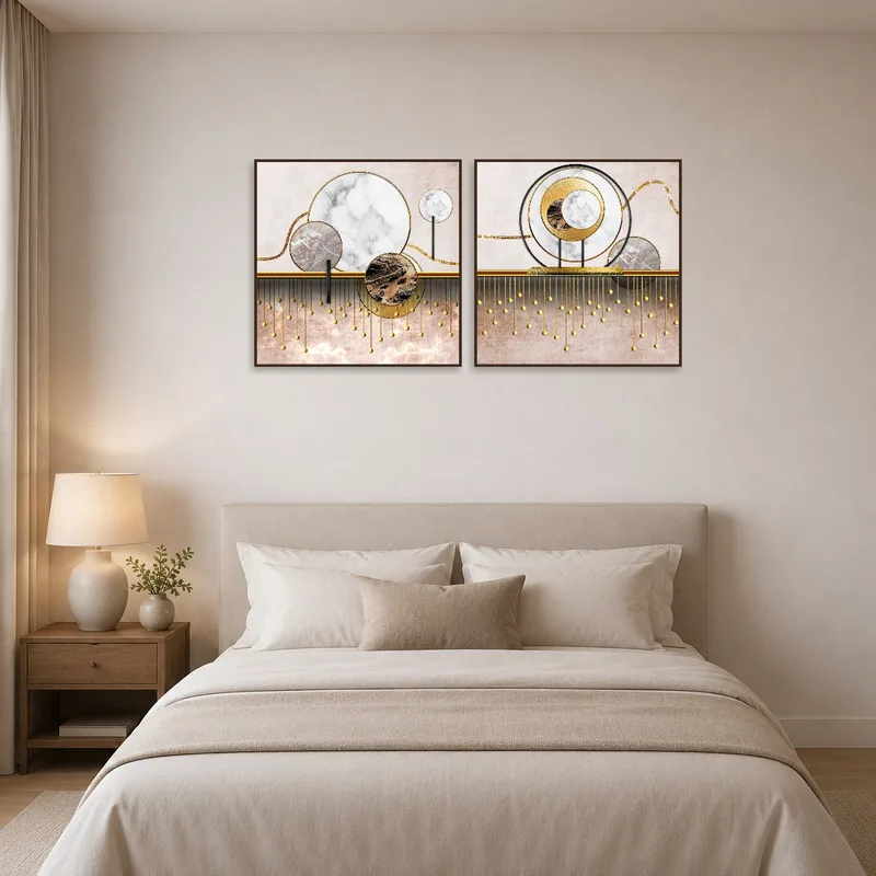 Sophisticated marble and gold geometric print above a plush bedroom bed.
