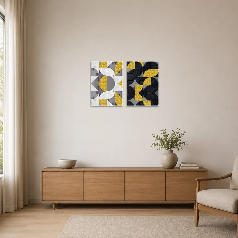Minimalist room with geometric art pieces in gold and gray on a white wall.