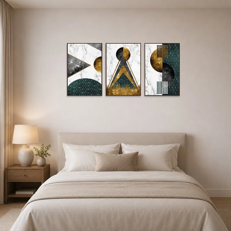 Gold and marble triptych brings a touch of luxury to a serene bedroom.