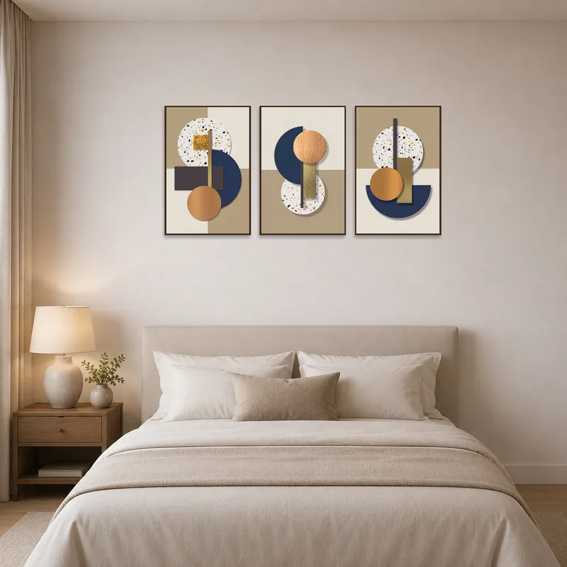 Earthy and metallic geometric pieces add a serene touch above a bed with soft linens.
