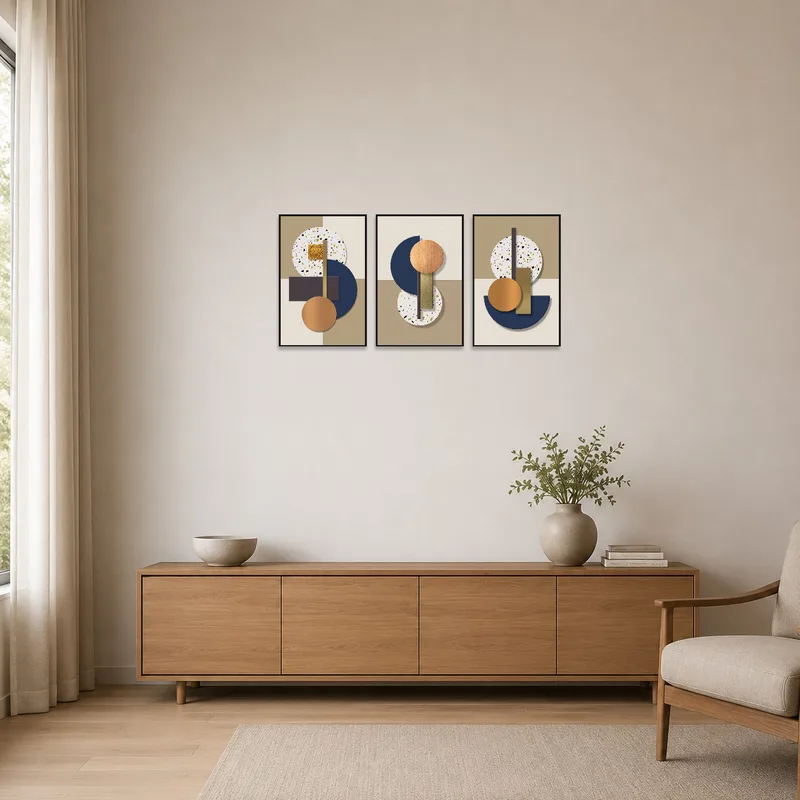 Geometric artworks with earthy and metallic tones accent a minimalist space with clean lines.