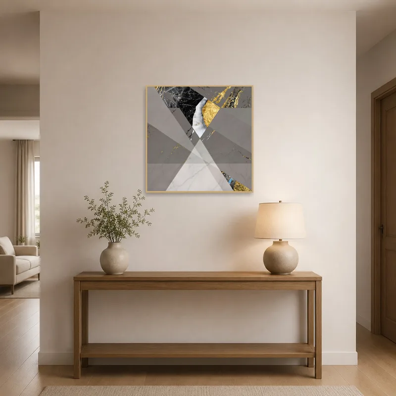 A geometric marble and gold print enhances the elegance of an entrance hall.