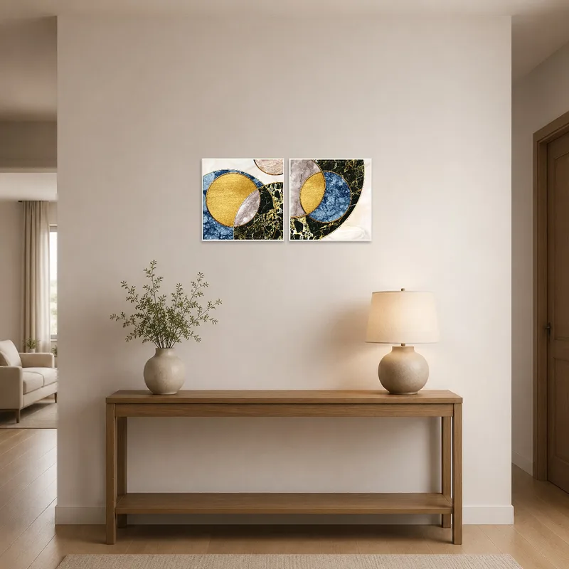 Entrance hall with geometric marble and gold circle art hung prominently.