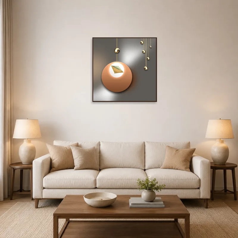 Geometric metallic abstract art hung above a modern sofa in a chic living room.