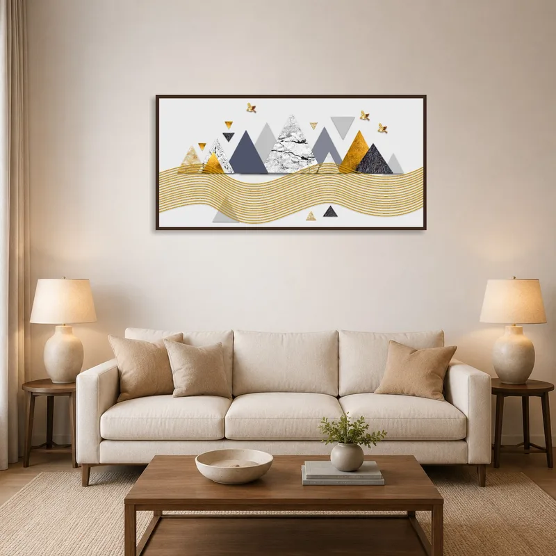 Geometric mountain abstract with gold accents on a living room wall.