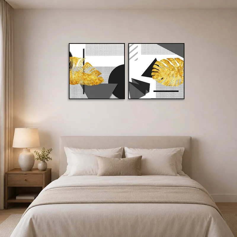 Geometric art with gold leaf accents providing elegance to a tranquil bedroom.