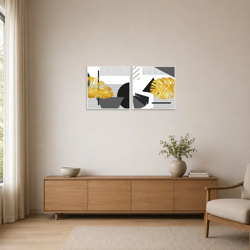 Simplistic geometric prints with gold details complementing a minimalist room's sleek decor.