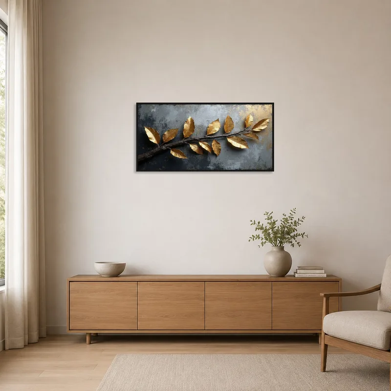 Gilded botanical branch art in a minimalist room with sparse furnishings.