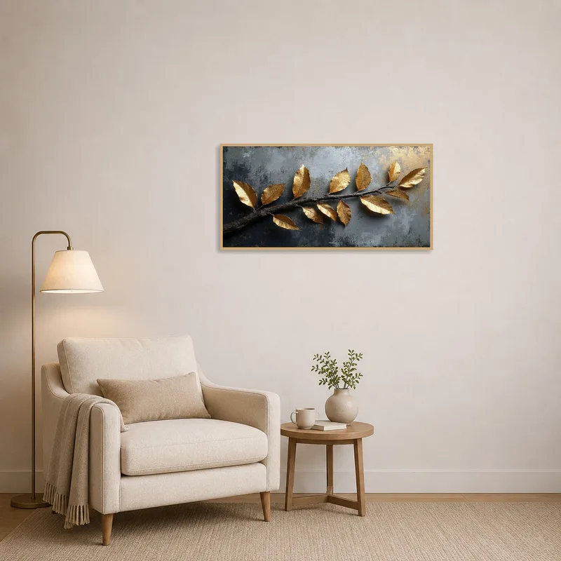 Gilded botanical branch art beside a cozy chair in a reading corner.