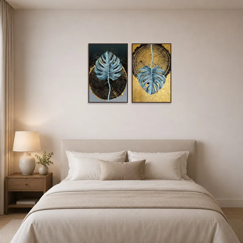 Bedroom with calming botanical prints of monstera leaves in gold tones.