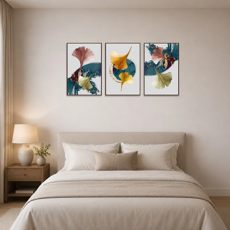 Abstract ginkgo leaf art in earthy tones adding warmth to the bedroom wall.