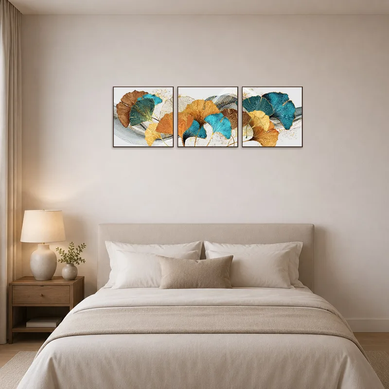 Ginkgo Leaves Abstract Triptych adding tranquility above a bed in a calm bedroom.