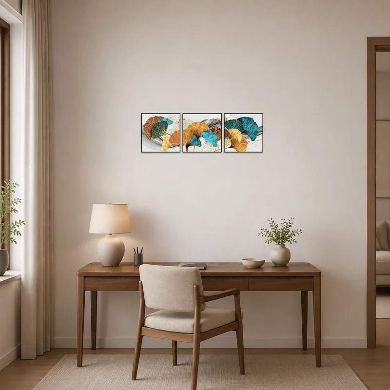 Ginkgo Leaves Abstract Triptych enhancing creativity in a neat home office space.