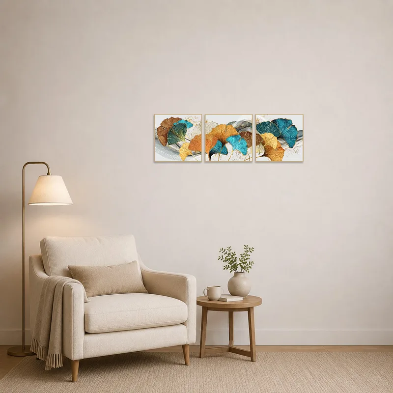 Ginkgo Leaves Abstract Triptych creating a serene atmosphere in a cozy reading corner.