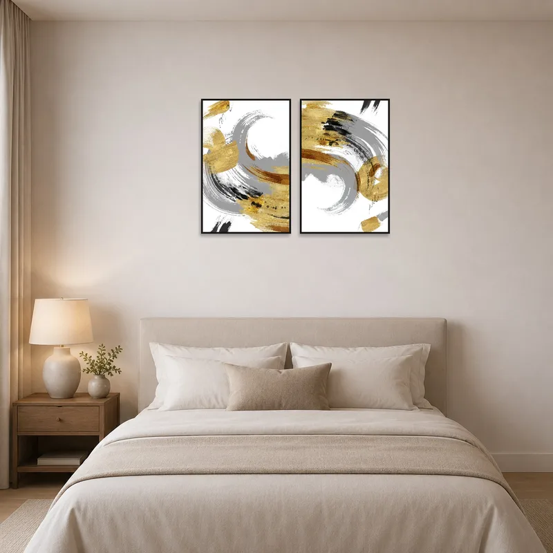 Abstract brushstrokes in gold and gray add luxury to a bedroom above a plush headboard.