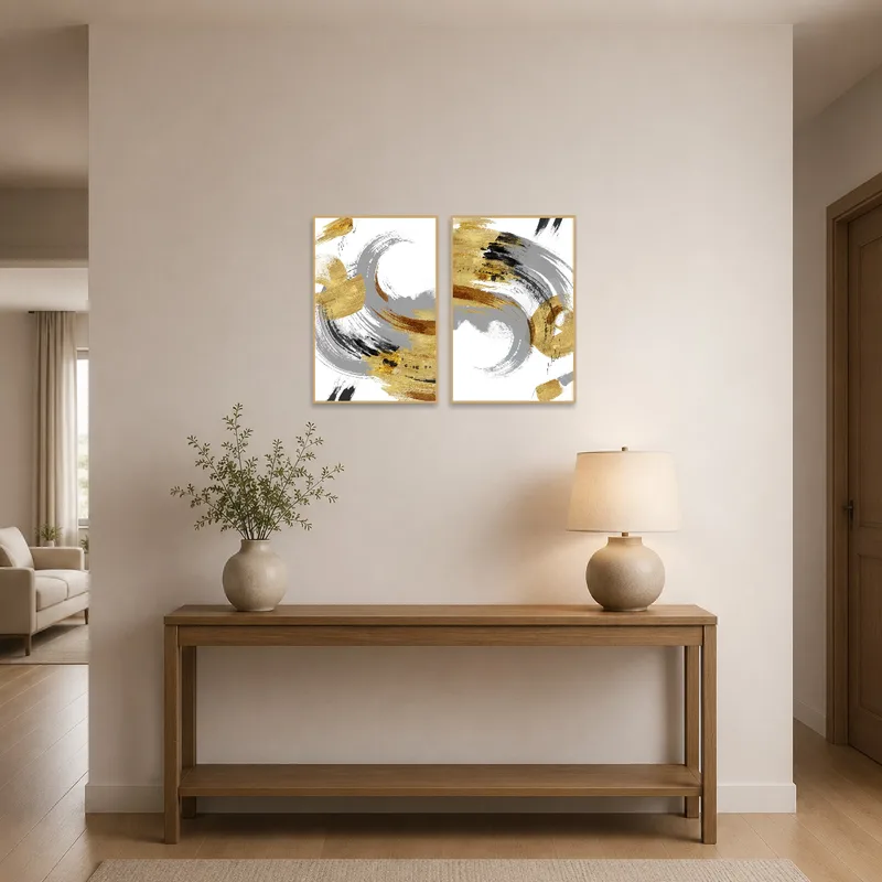 Bold gold and gray brushstrokes catch the eye in an entrance hall with elegant lighting.