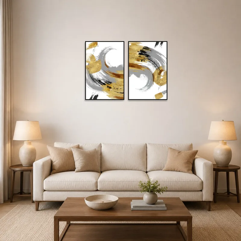 A gold and gray brushstroke artwork hanging on a living room wall above a modern sofa.