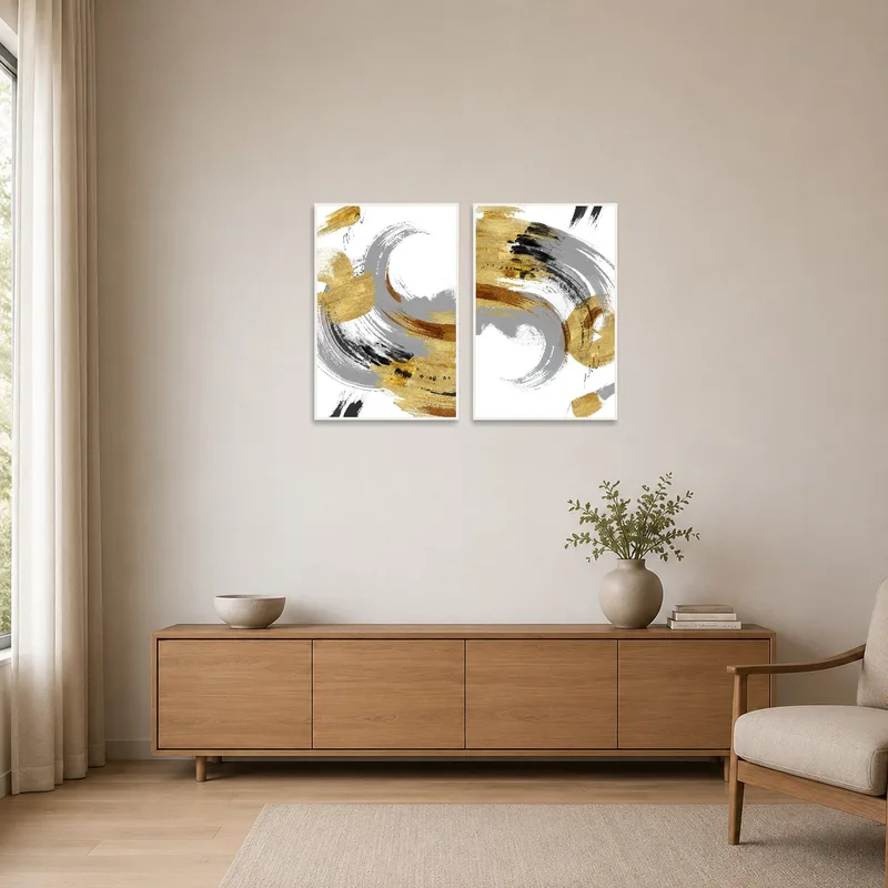 The gold and gray abstract brushstroke art complements a minimalist room with sleek furniture.