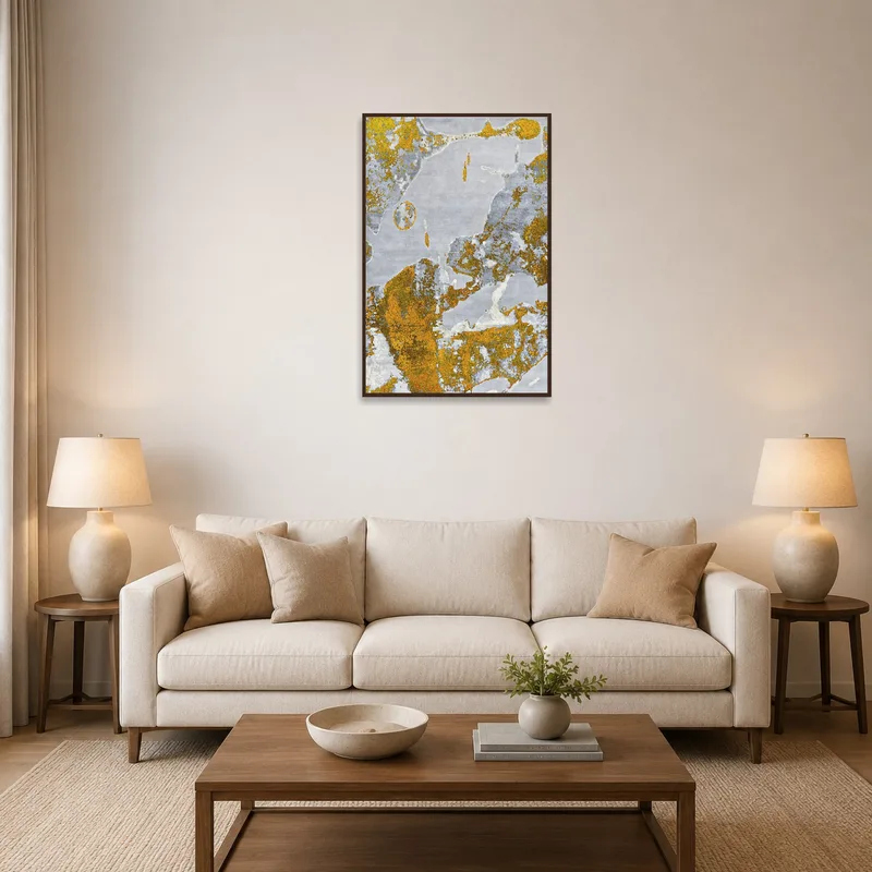 A gold and gray abstract print adds elegance to a cozy living room setting.