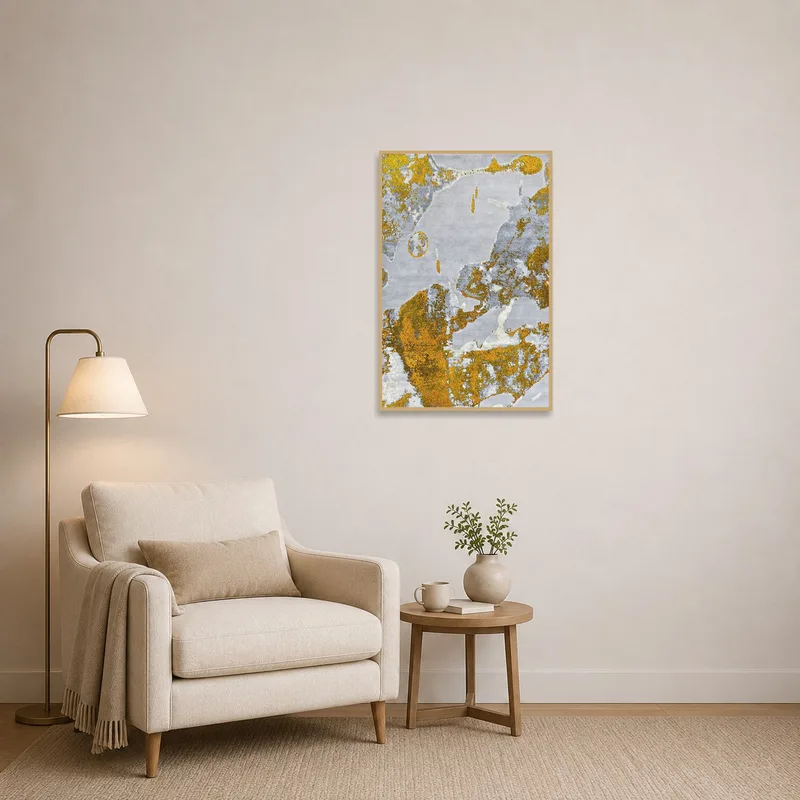 An abstract gold and gray print enhances a tranquil reading corner.