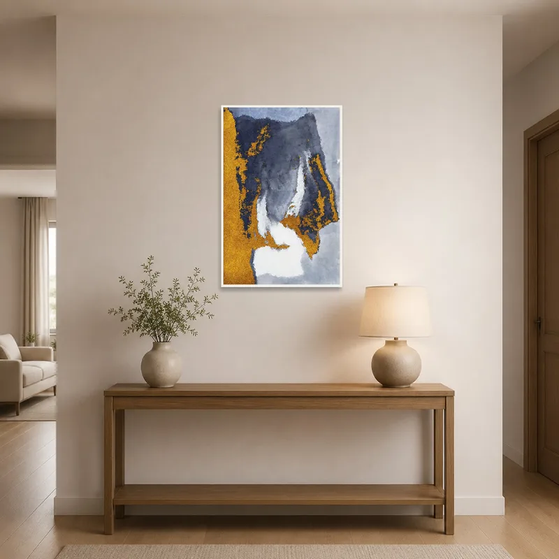 Gold and gray abstract art greeting visitors in a chic entrance hall.