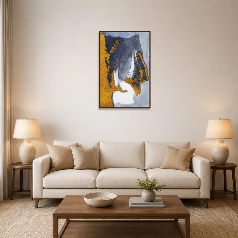 Gold and gray abstract artwork above a cozy living room sofa.