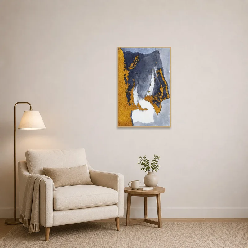 Gold and gray abstract work enhancing a peaceful reading corner.