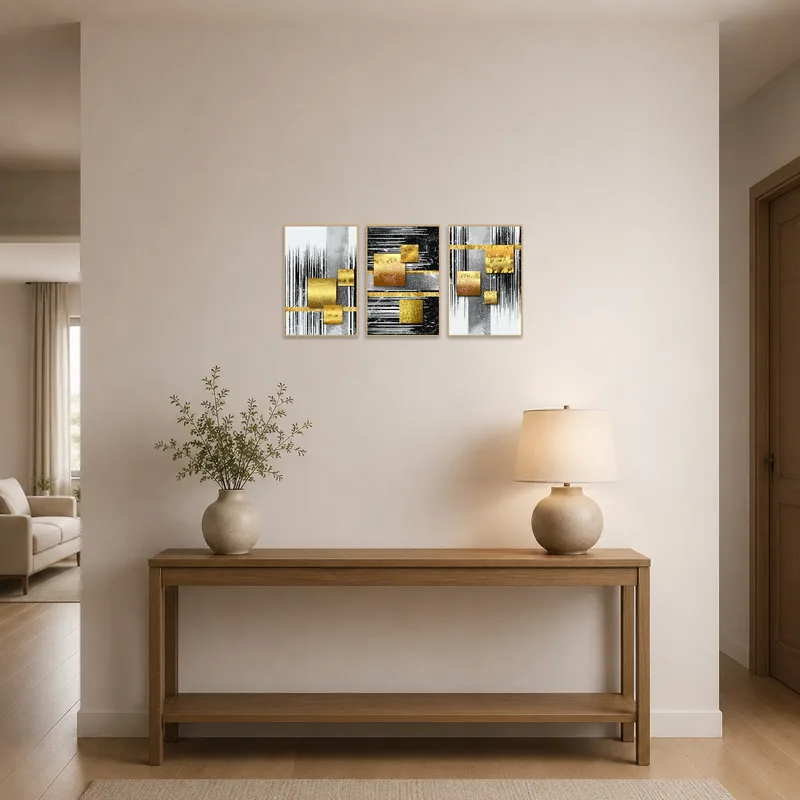 Gold and silver abstract geometric panels greeting guests in the hallway.