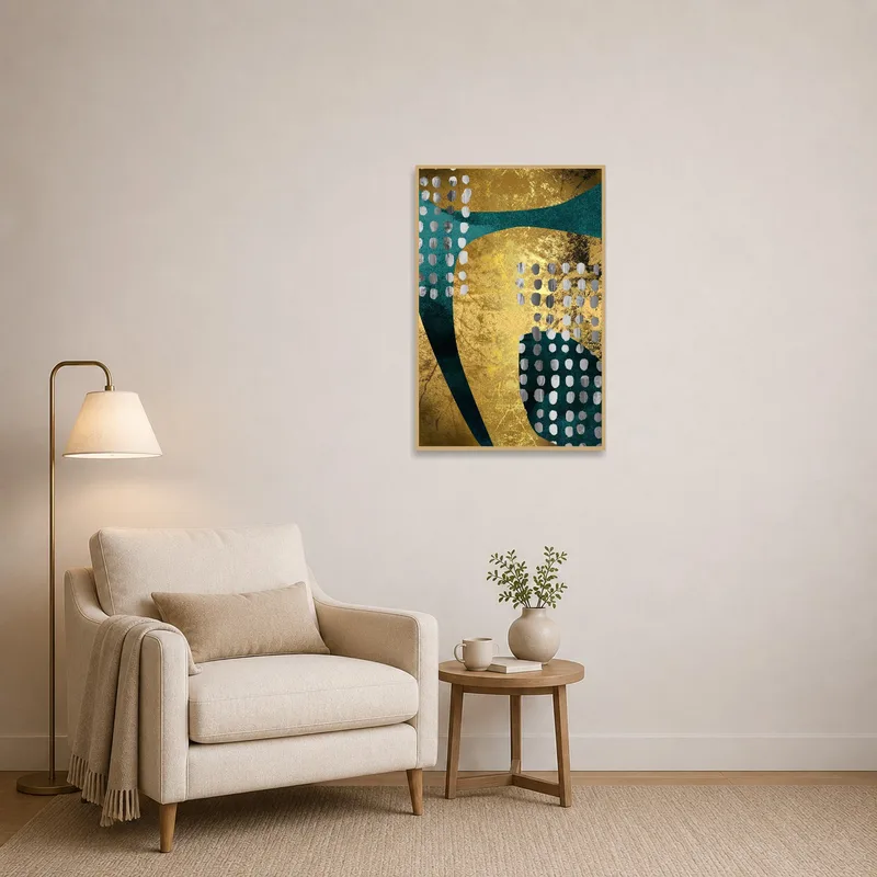 A cozy reading corner with gold and teal abstract wall art.