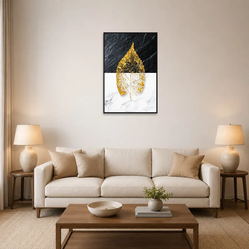 Artwork with gold leaf and marble displayed above a modern sofa in a stylish living room.