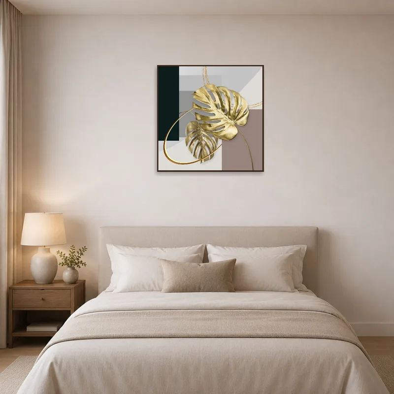 Gold monstera leaves artwork enhances a tranquil bedroom.