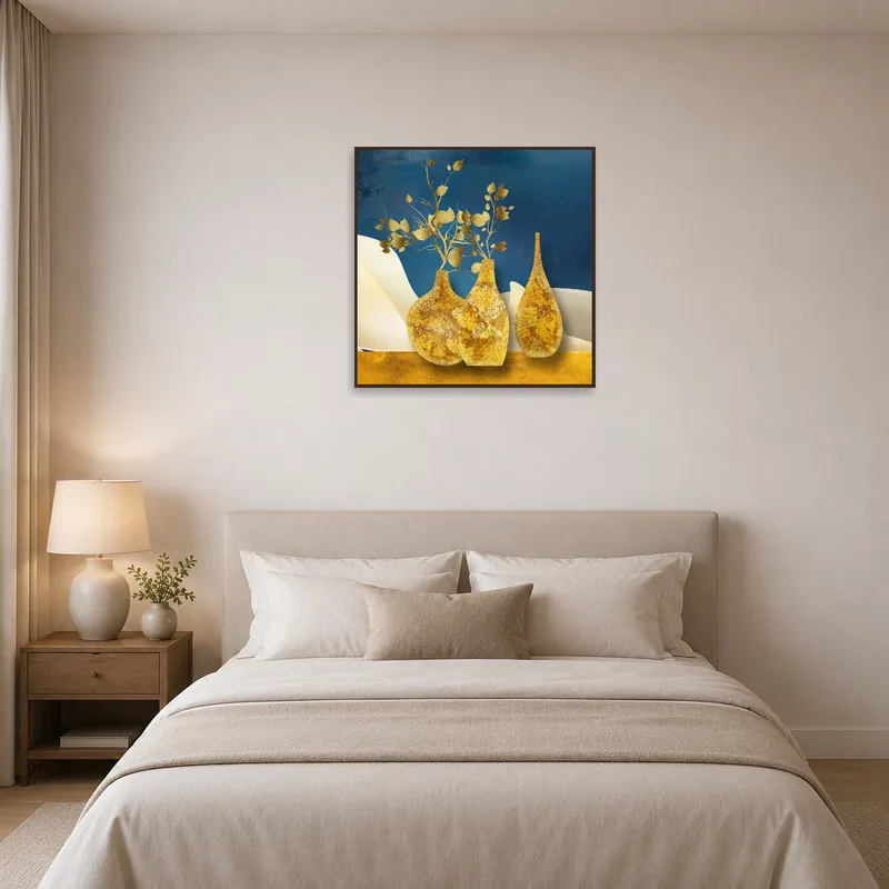 Gold-toned vases artwork creating a soothing atmosphere in the bedroom.
