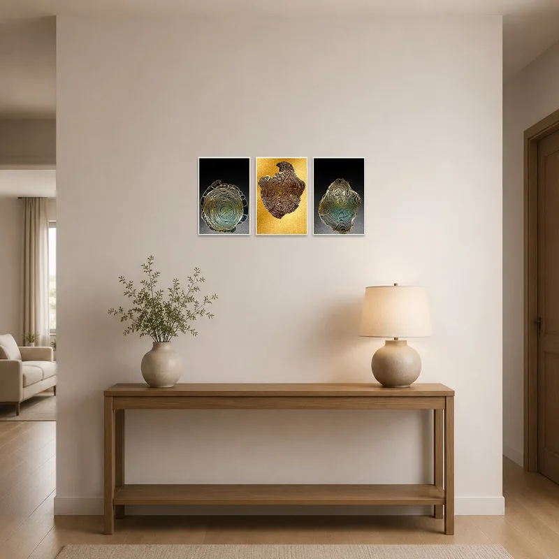 Gold Tree Rings Abstract Triptych greets visitors in a sleek entrance hall with marble flooring.