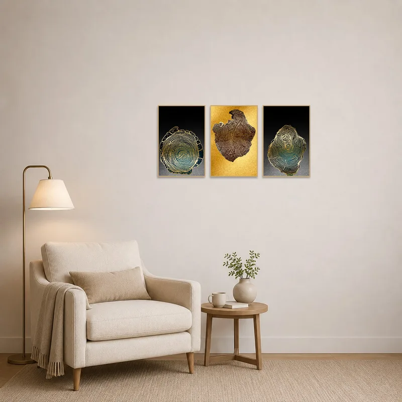 Gold Tree Rings Abstract Triptych adds elegance to a quiet reading corner with a plush armchair.