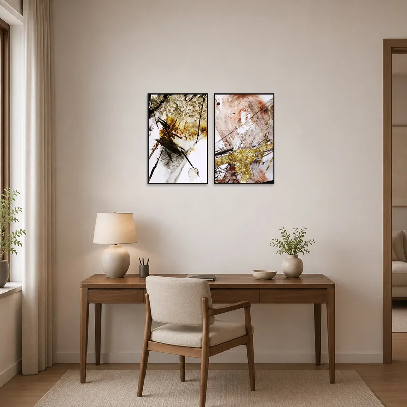 Twin pieces of golden abstract brushwork energizing a creative home office.