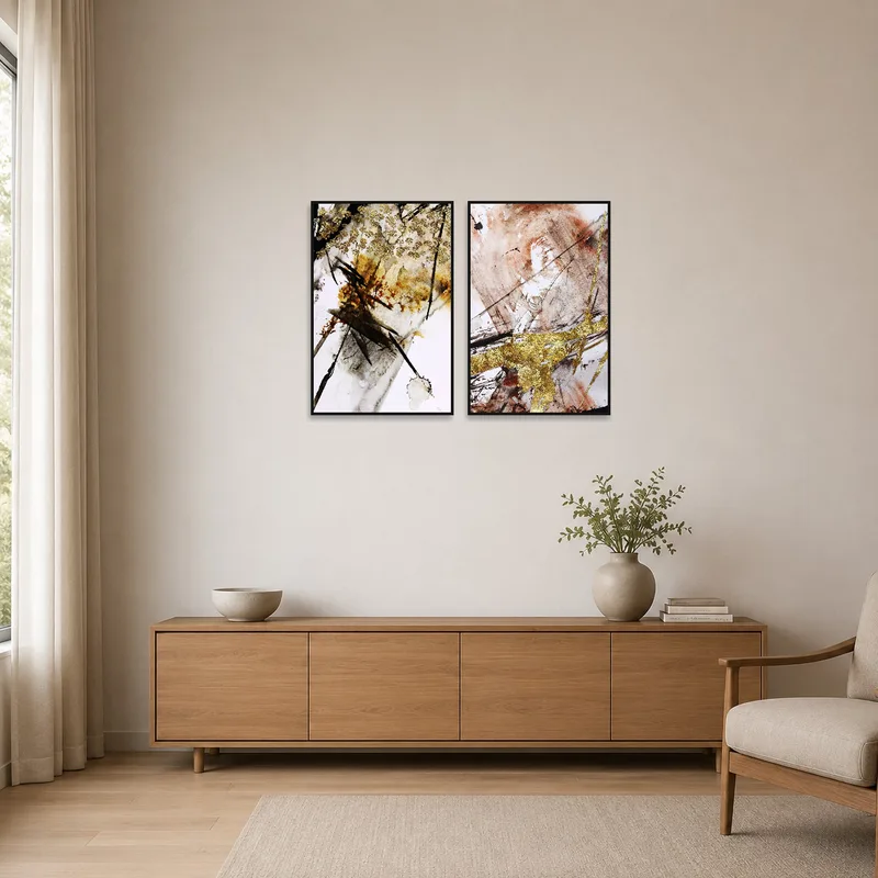 Golden abstract brushwork set accentuating a minimalist room's white walls.