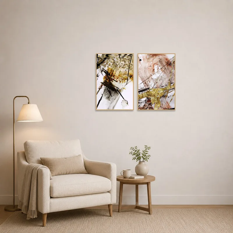 Artworks with golden brushstrokes brightening up a cozy reading corner.