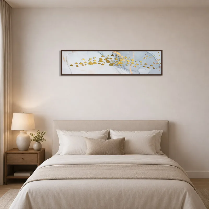 Golden geometric marble art piece adds sophistication to a serene bedroom setting.