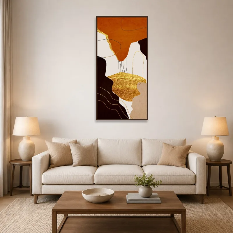 Vertical golden abstract art on a living room wall beside a modern gray sofa.