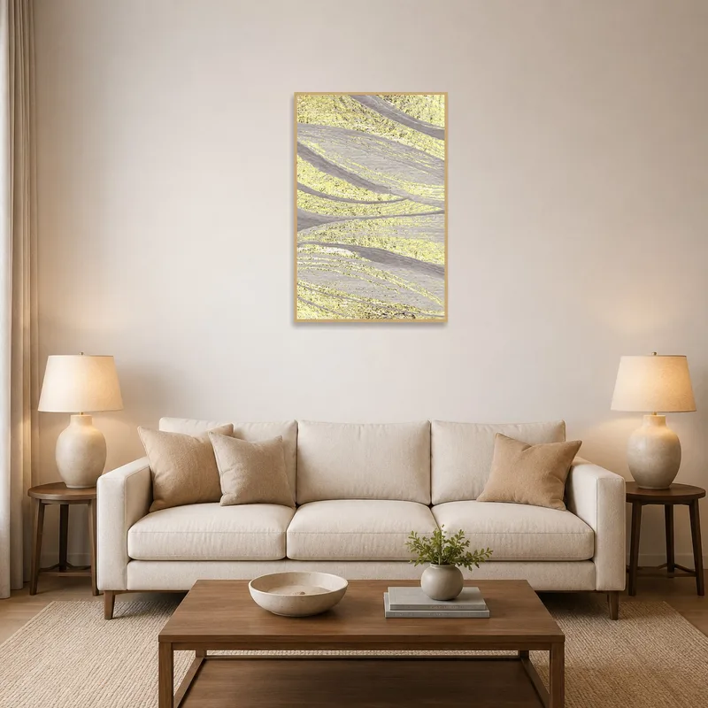 Golden abstract textured waves art above modern living room sofa.