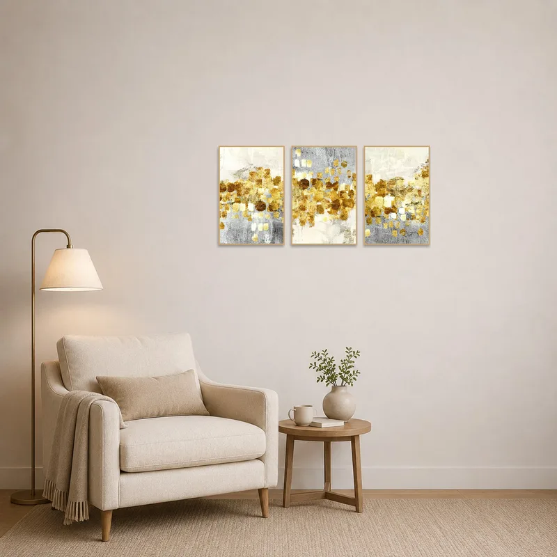 Golden abstract triptych enhancing the reading corner with metallic brushstrokes.