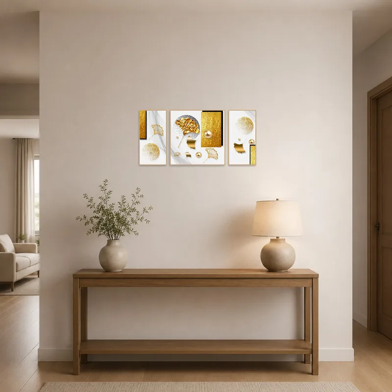Geometric golden abstract triptych greeting guests in an entrance hall.