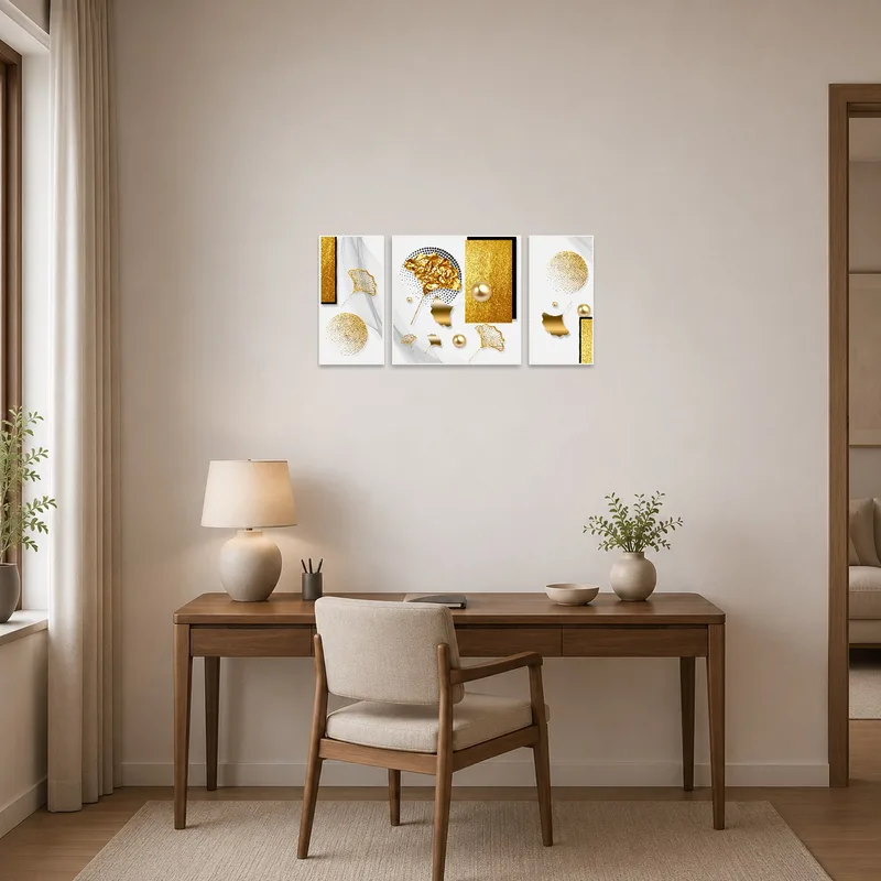 Abstract triptych with golden elements inspiring a home office area.
