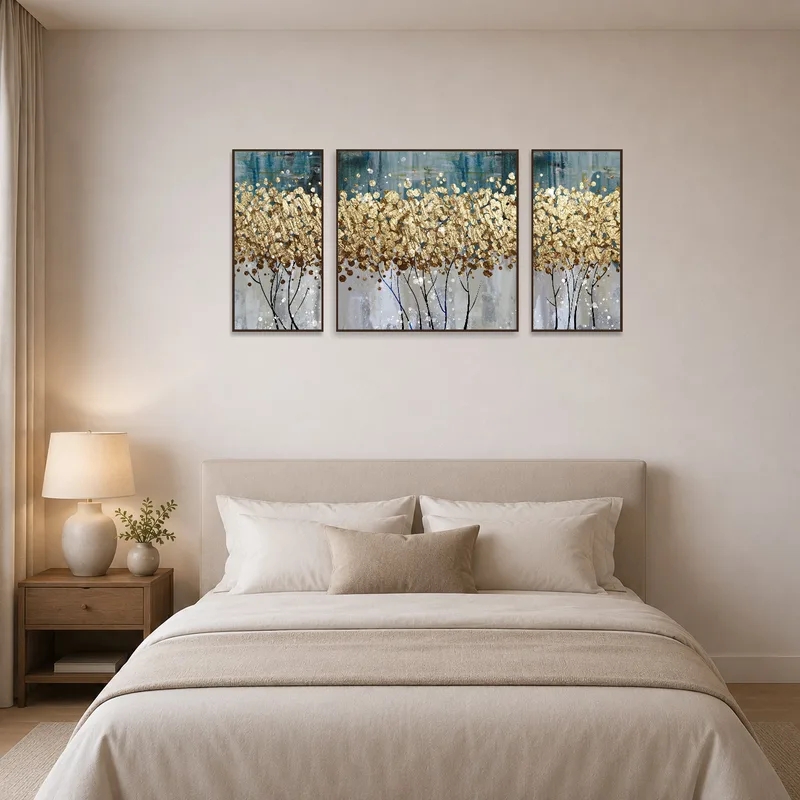 Warm golden abstract triptych with textures complements the tranquil bedroom.