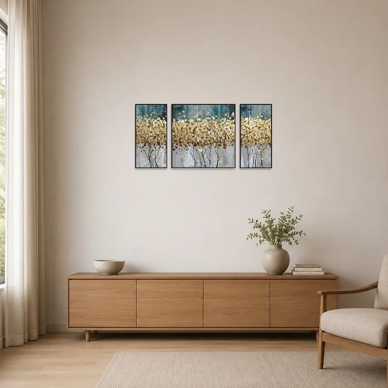 The minimalist space is enhanced by a golden abstract triptych with textures.