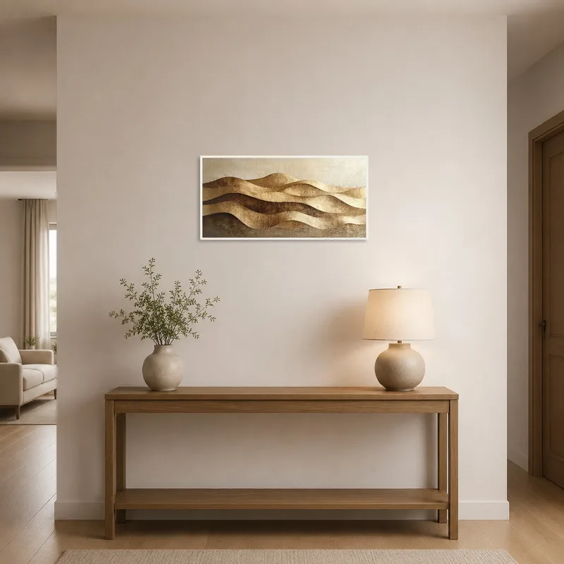 Artwork with golden waves adding elegance to a sleek entrance hall.